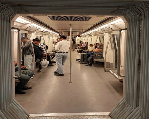 Commuters traveling comfortably in Delhi Metro
