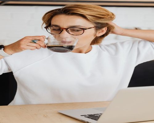 Professional taking a short break from laptop work at home
